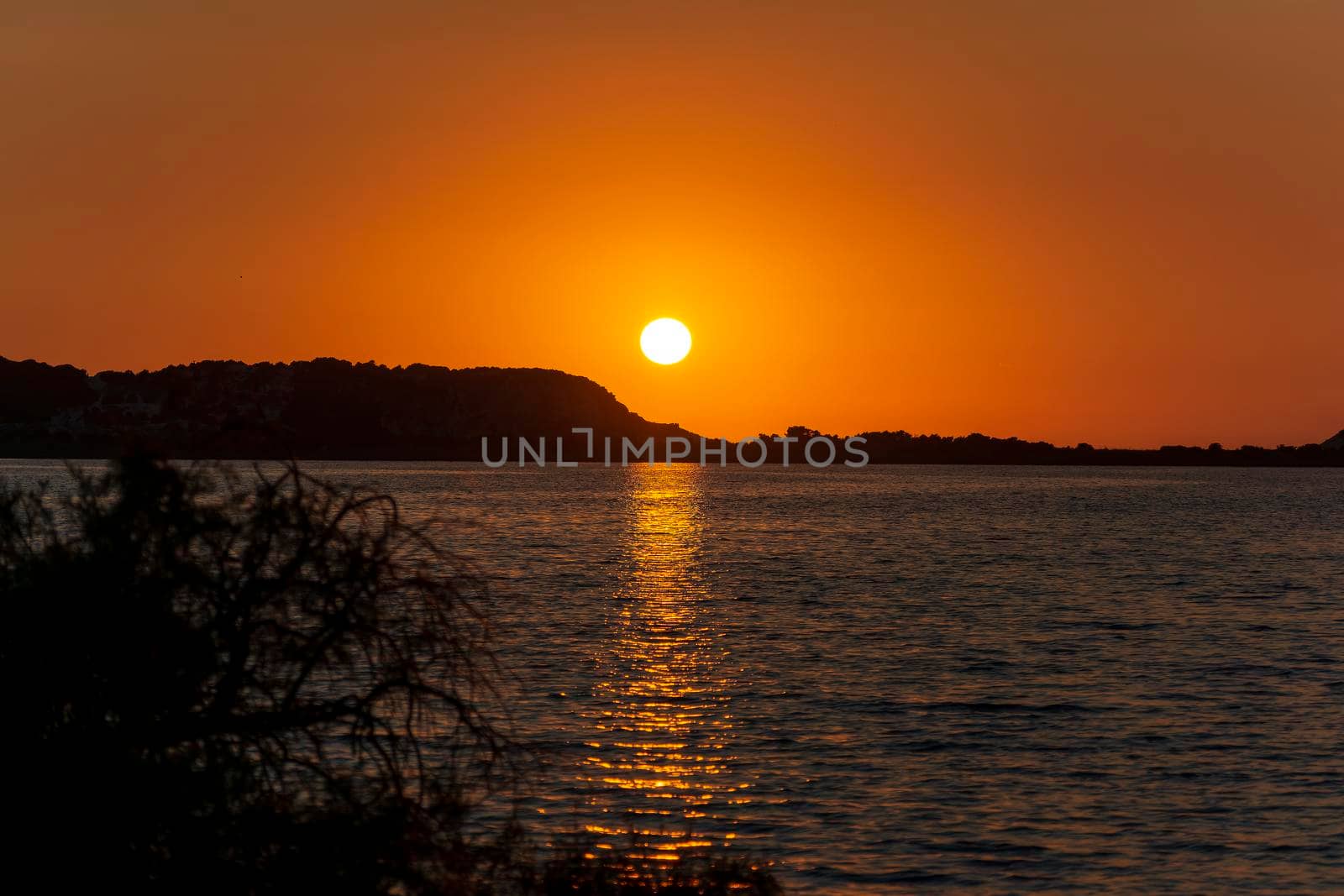 Sunset at the gialova lagoon. The gialova lagoon is one of the most important wetlands in Europe, as it constitutes the southernmost migratory station of migratory birds in the Balkans to and from Africa.