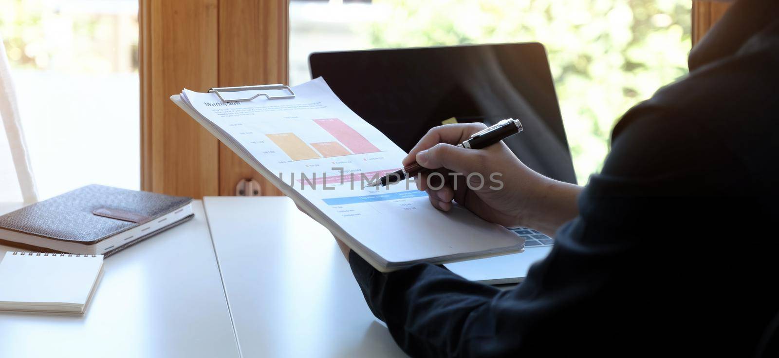 Businessman investment consultant analyzing company annual financial report balance sheet statement working with documents graphs. Concept picture of business, market, office, tax..