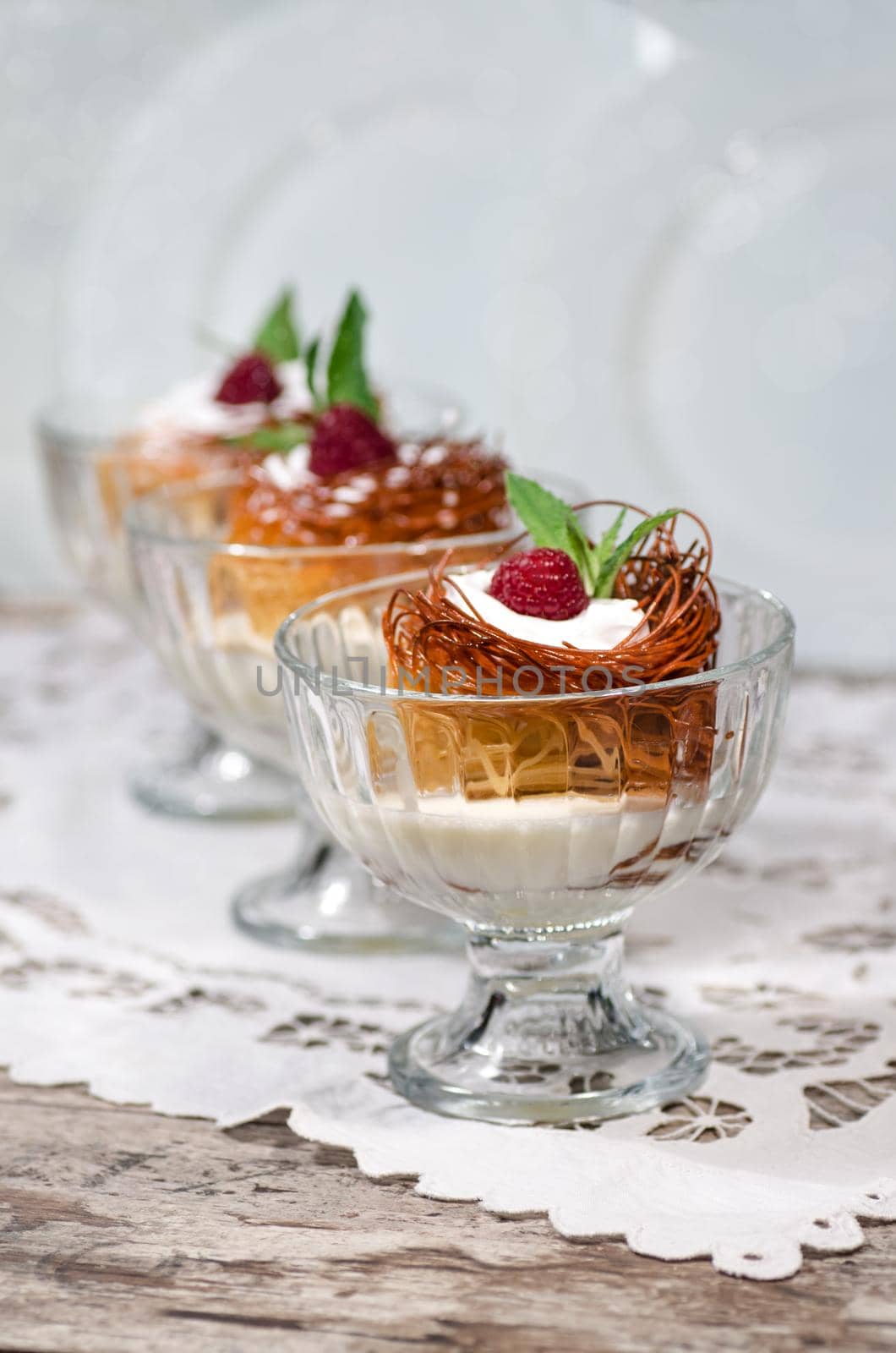 Easter dessert with raspberries and whipped cream From series Sweet pasta Blurred background with bokeh effect