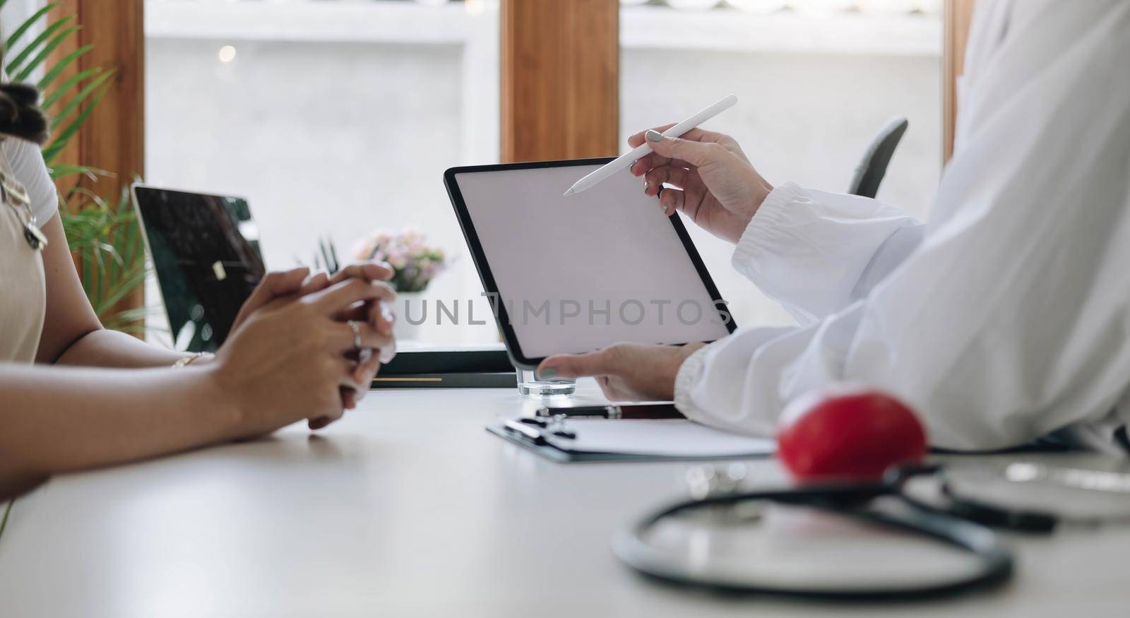 Doctor discussing and explain to patient about life plan. Medicine and health care and insurance concept..