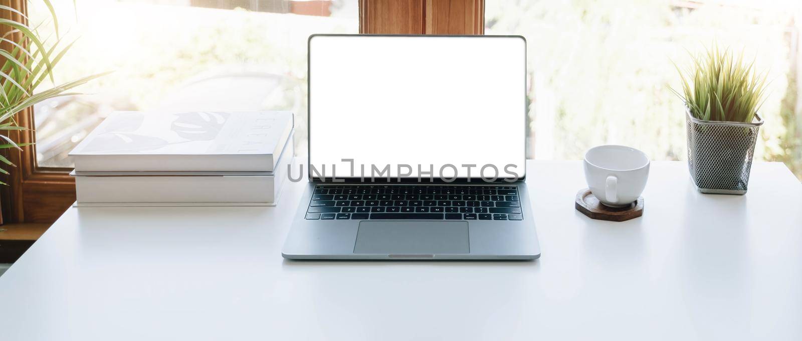Digital tablet with white blank screen on table. workspace in modern office concept...