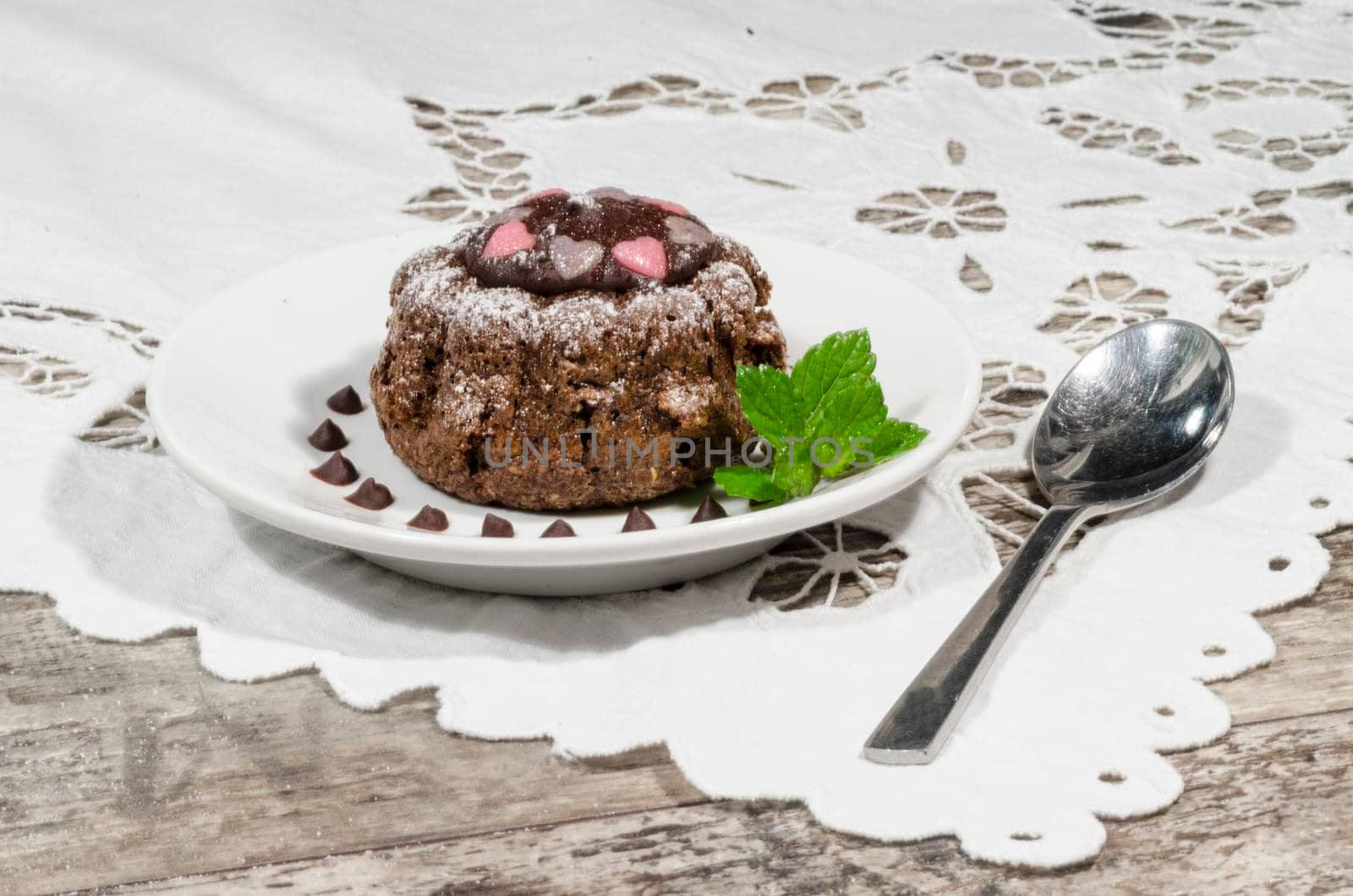 Diet chocolate cupcakes on a plate decorated with chocolate. From the series "Recipes for diet Ducane"