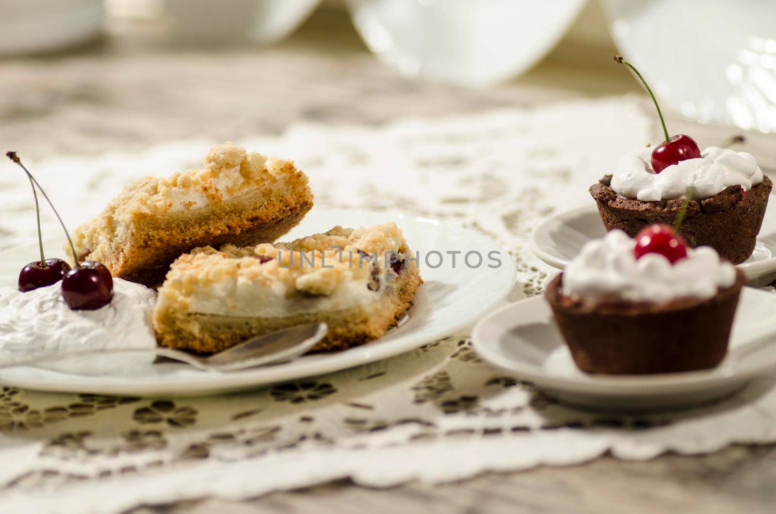 Chocolate dessert decorated with whipped cream and a cherry