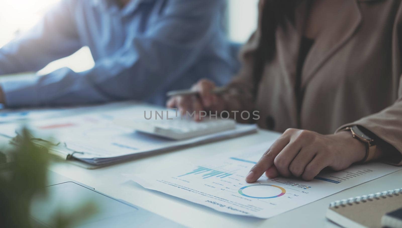 Close up Businessman and partner using desktop computer for analysis finance, tax, accounting, statistics and analytic research concept.