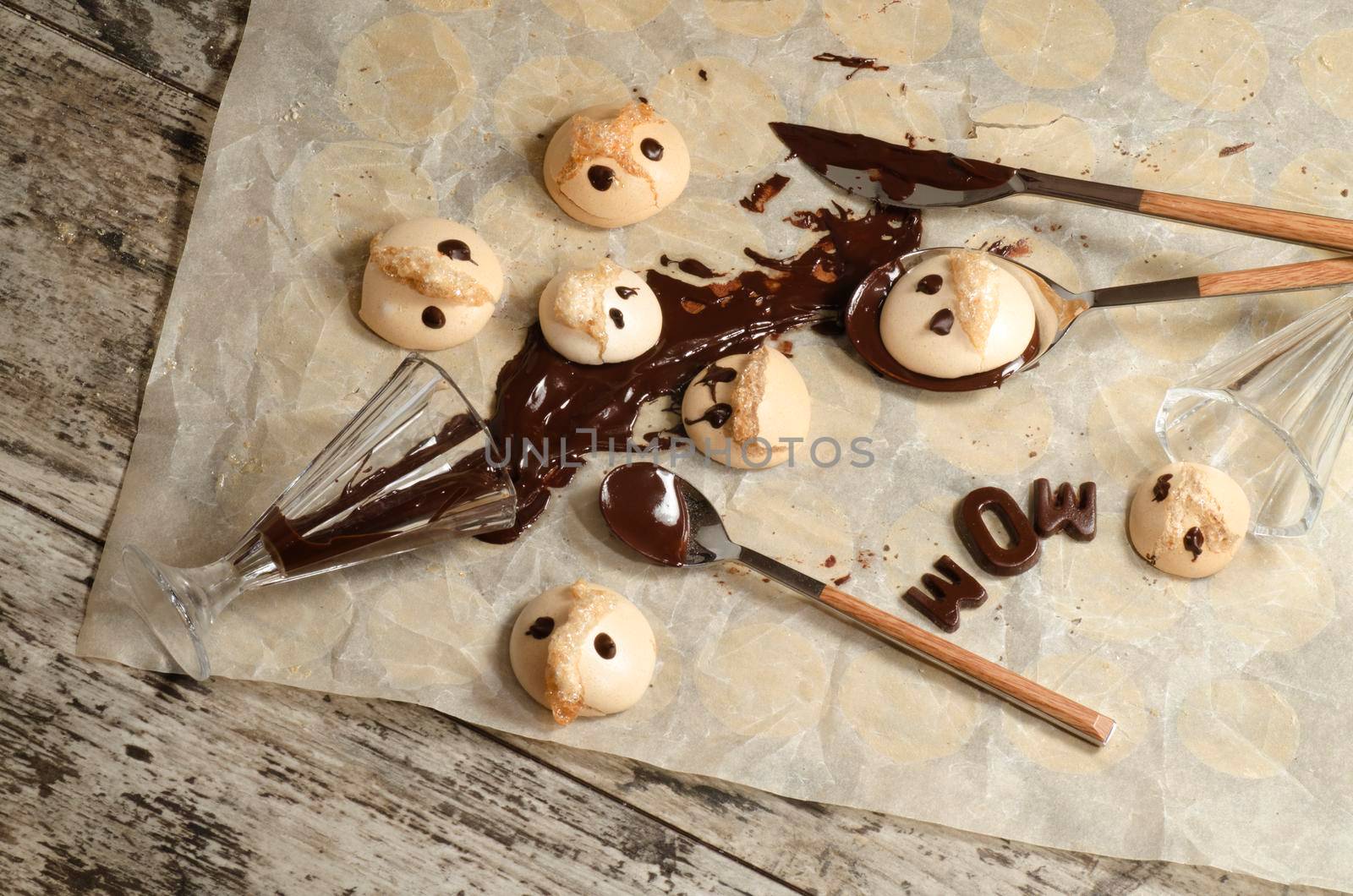 Funny meringue with chocolate on baking paper. From series Fun food