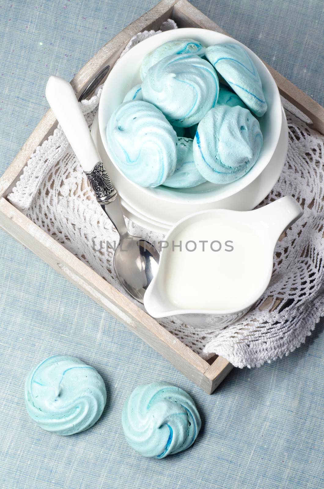 Azure homemade meringue cookies and cup of milk From series Christmas and New Year