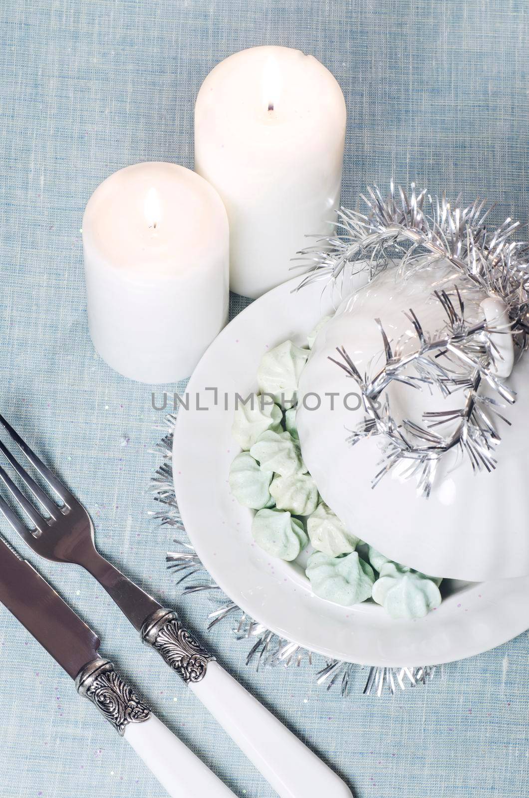 Christmas decorations and a little meringue with white candle. From series Christmas and New Year