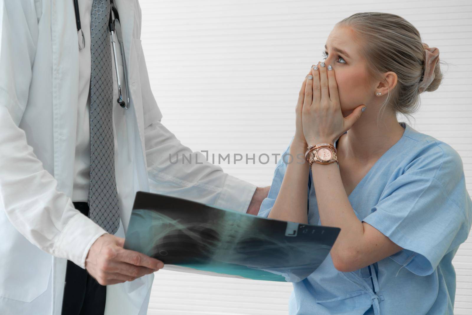 Doctor and unhappy patient at hospital or medical clinic . Healthcare medical malpractice and failure concept.