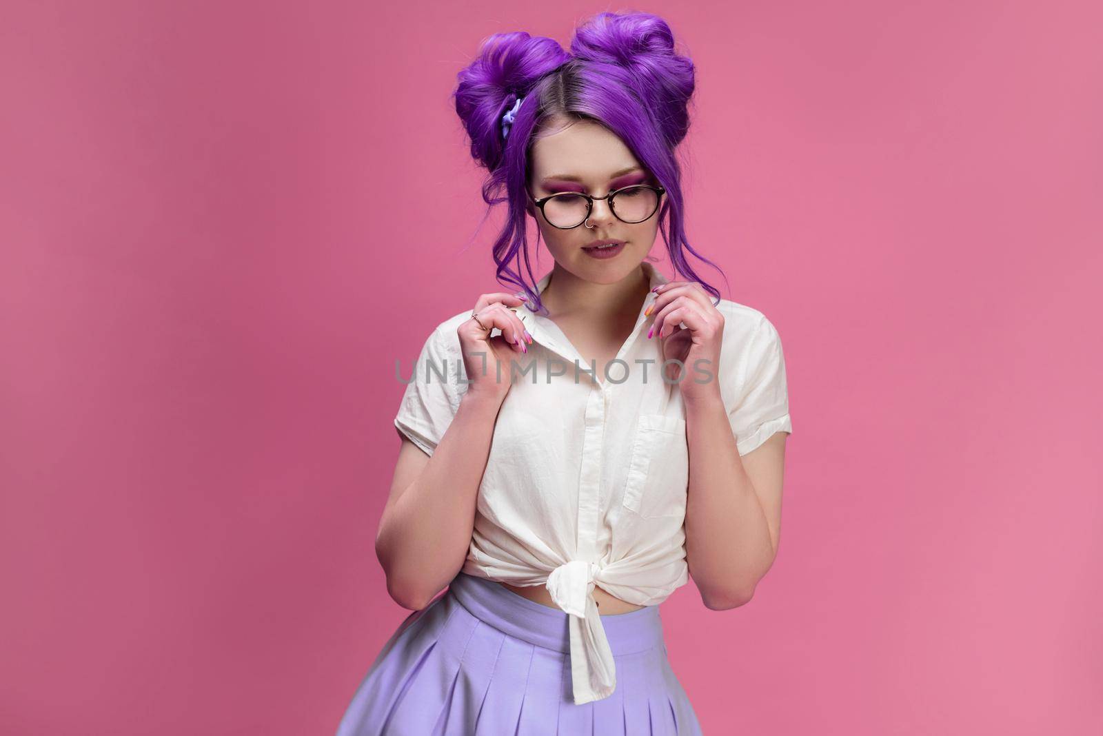 the bright girl with purple hair wearing glasses portrait on pink background
