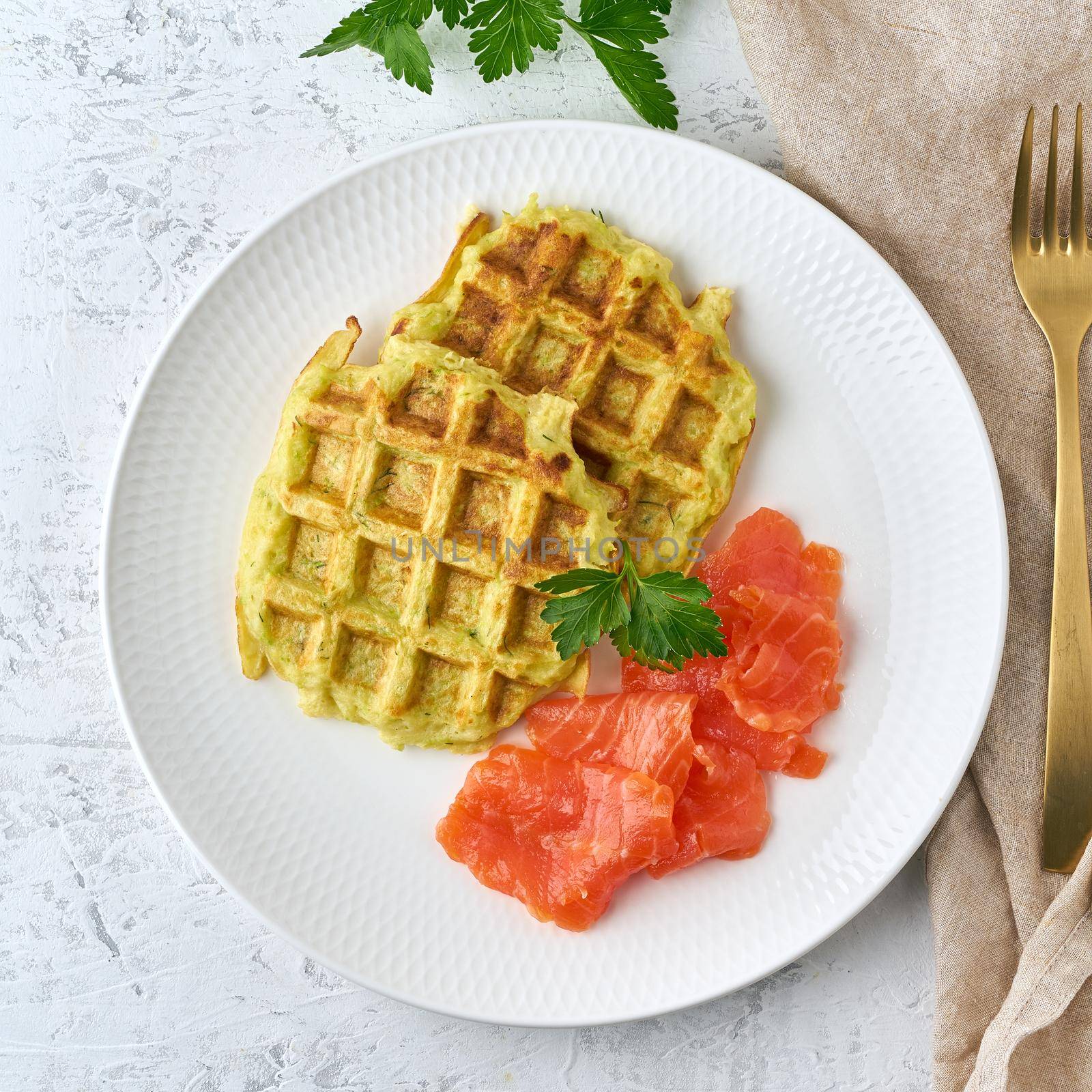 Zucchini waffles with salmon, fodmap diet top view by NataBene