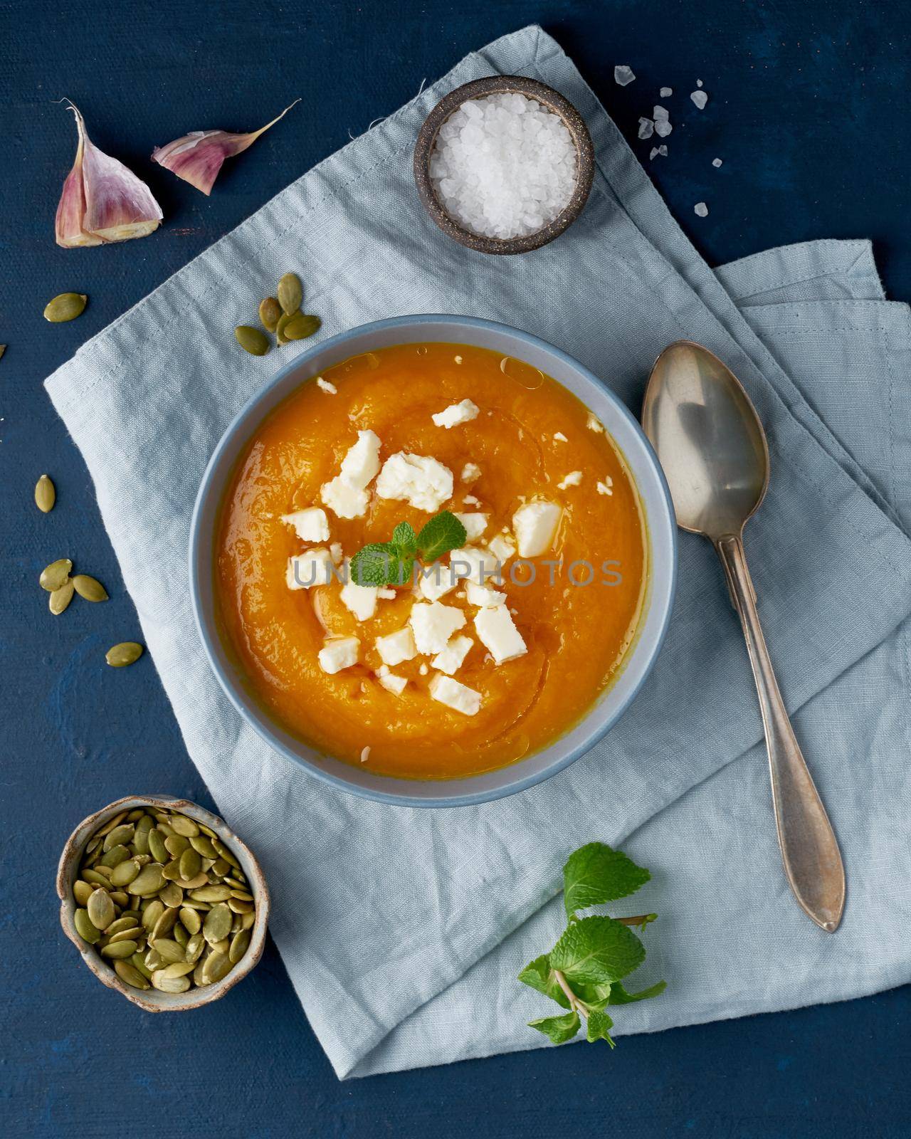 Pumpkin cream soup with sheep cheese, autumn homemade food, by NataBene