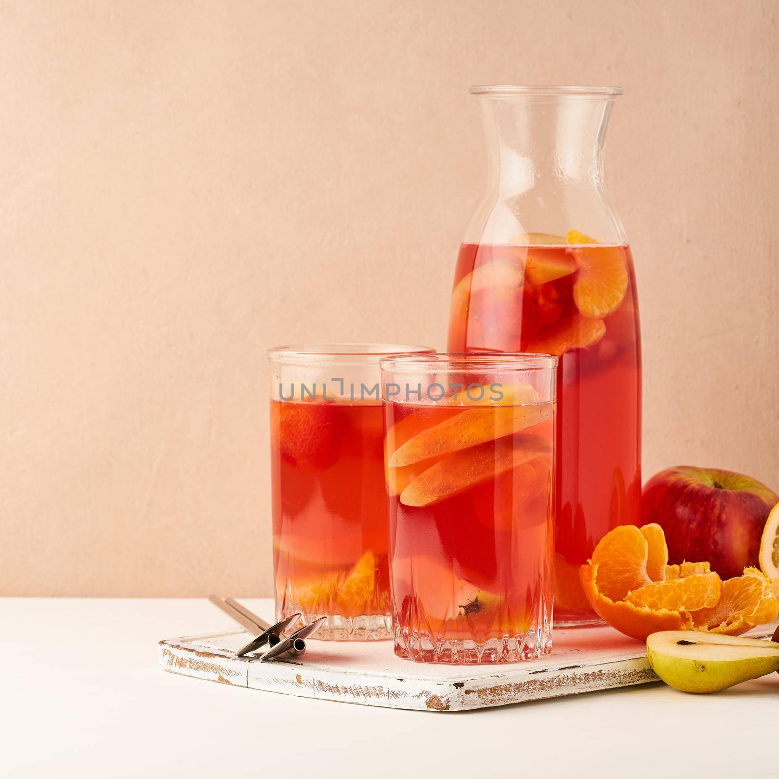 Stewed fruits in Glass Tube on pastel background side view copy space by NataBene