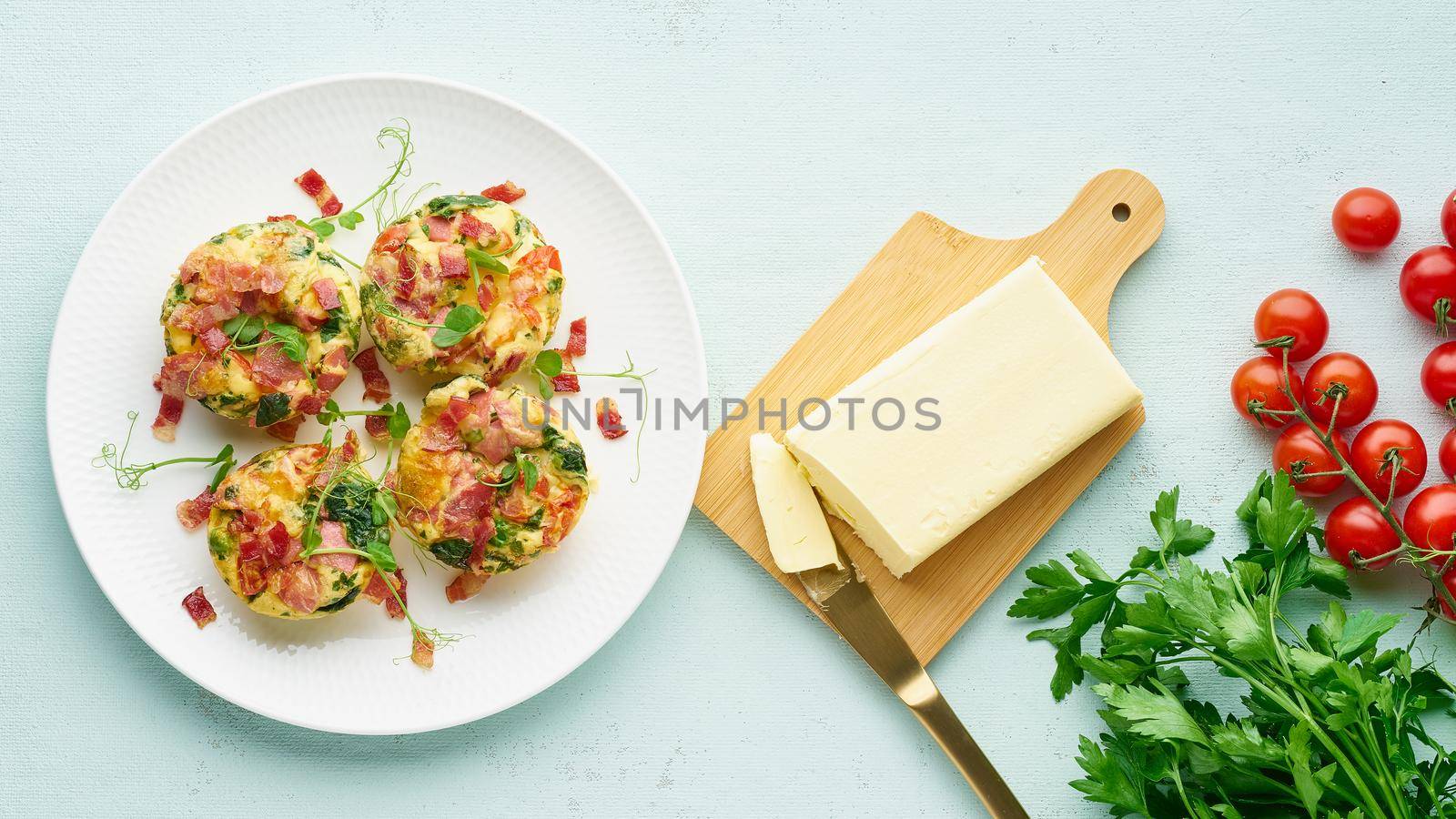 egg muffins with spinach, bacon and tomato, ketogenic keto diet low carb, pastel and modern background top view banner long