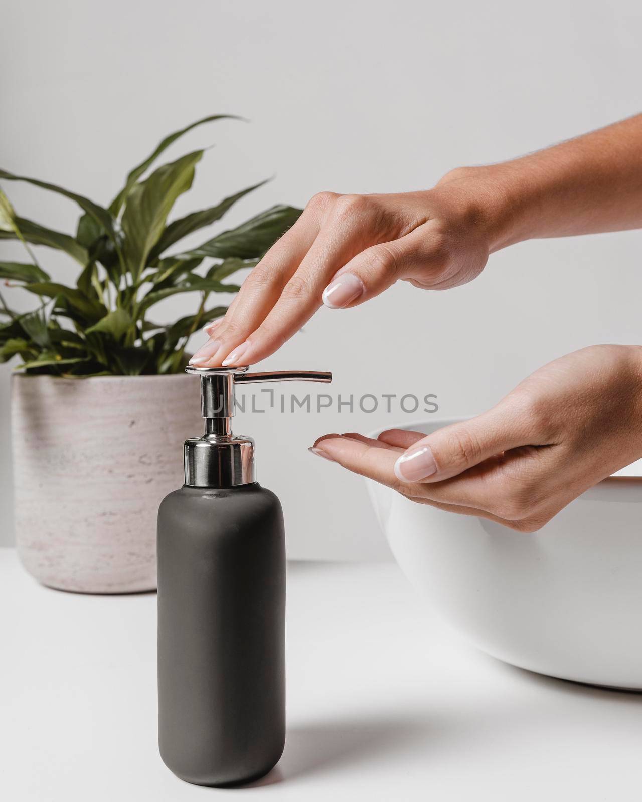 sideways woman using liquid soap
