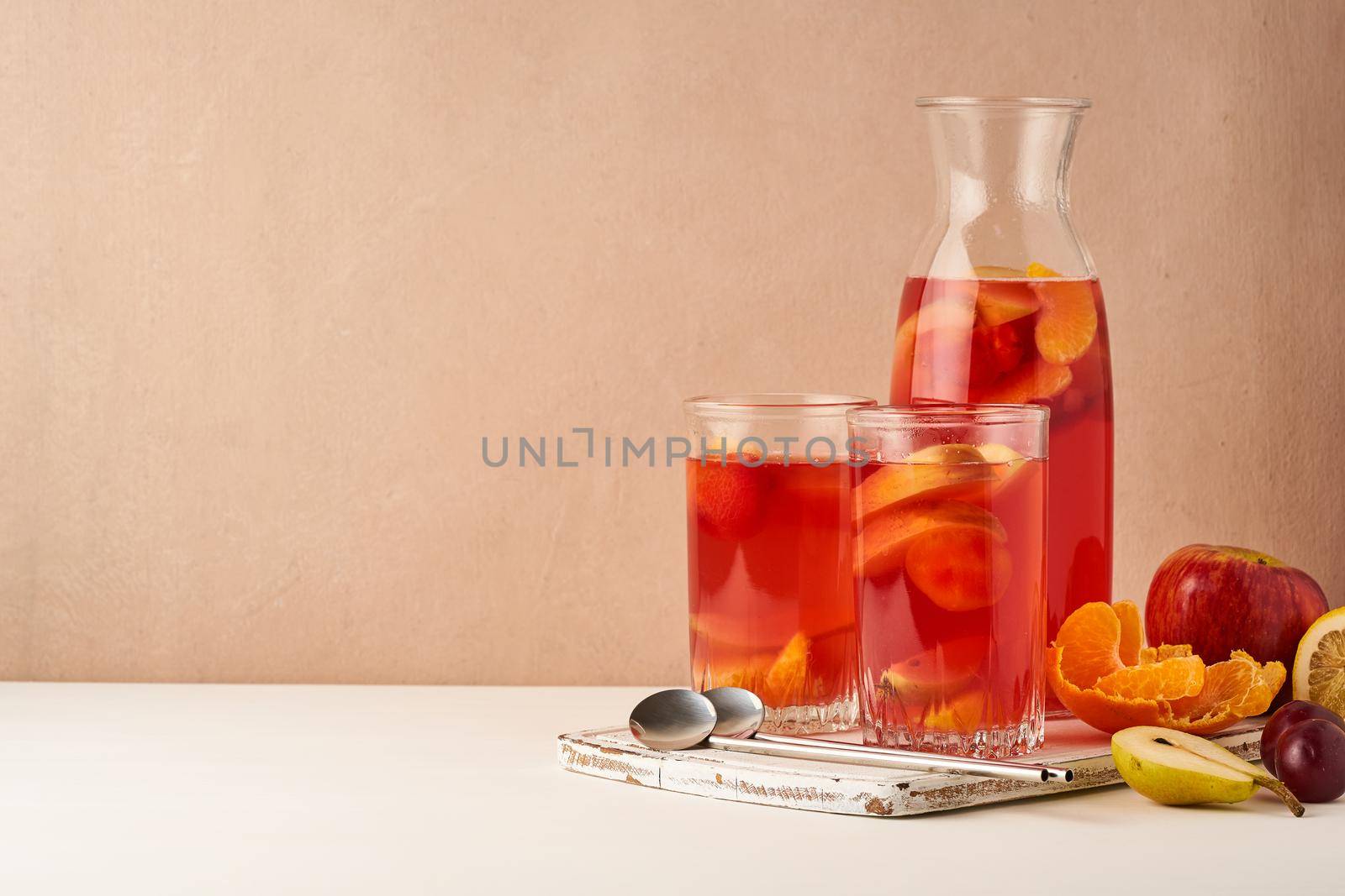 Multivitamin mocktail with fresh and ripe fruits, healthy compote for vegetarians