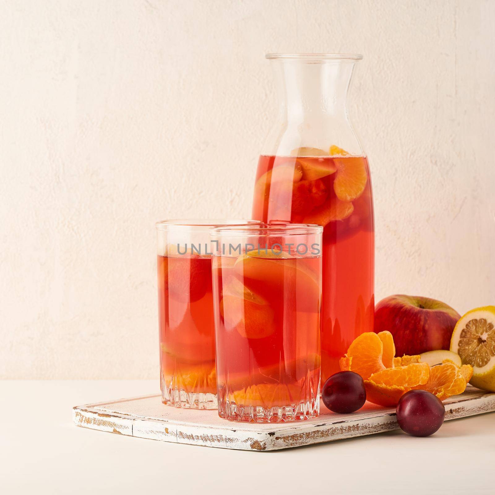 Stewed fruits in Glass Tube on pastel background side view copy space by NataBene