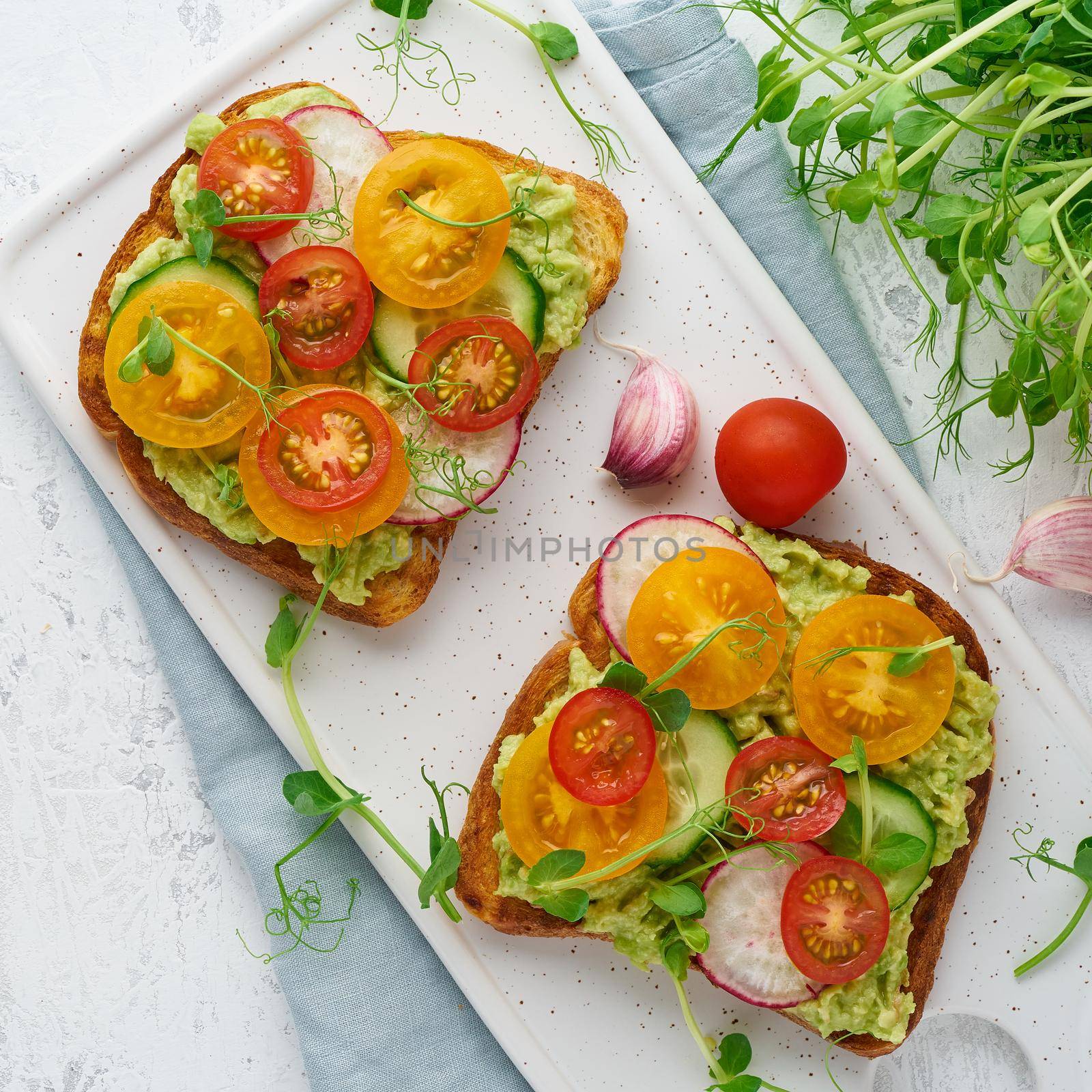 avocado toast with cherry tomatoes and herbs, breakfast by NataBene