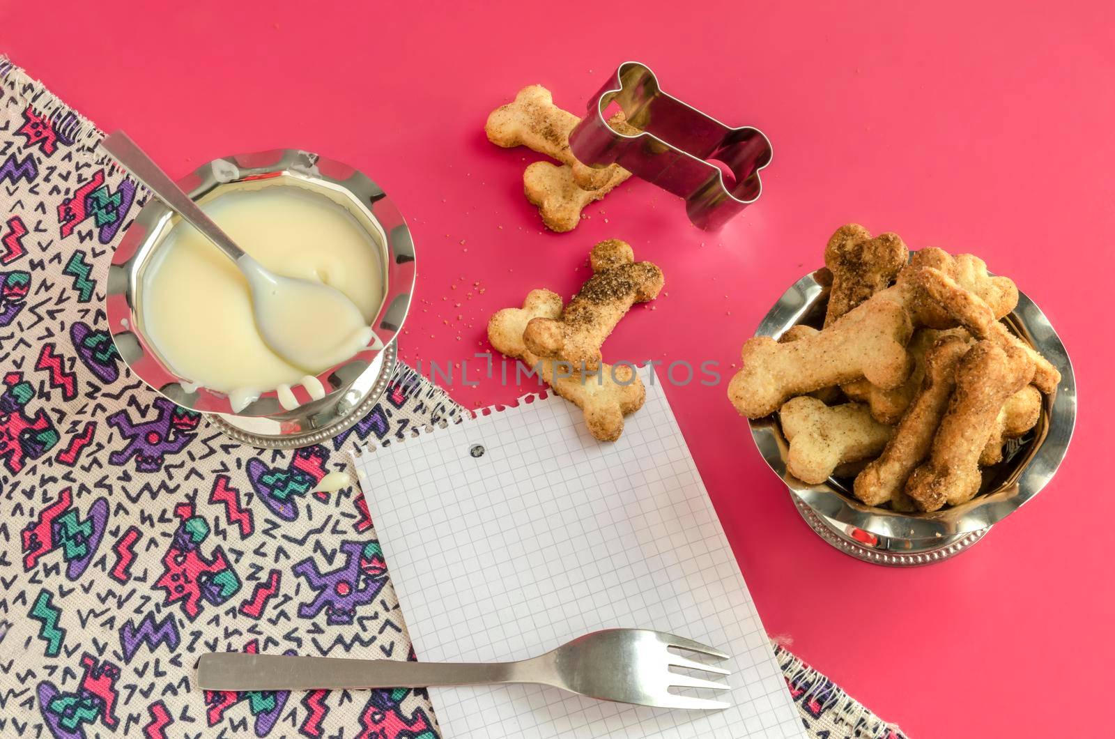 Bone sugar cookies and condensed milk, background for menu From series kids baking recipes