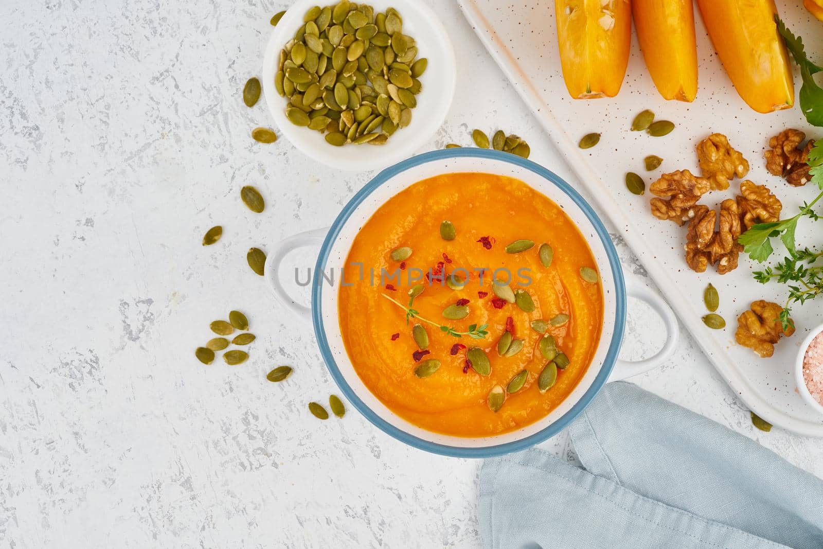 healthy lunch for vegetarians, cream soup with walnuts and pumpkin seeds