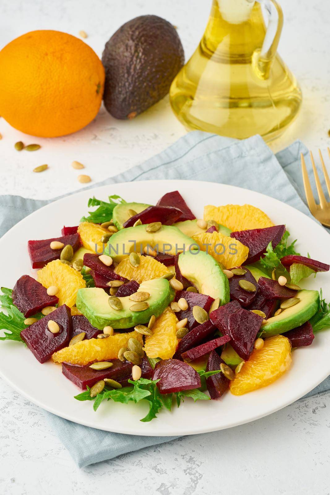 Vegan salad with beet curd avocado orange feta ricotta and pumpkin seeds, keto ketogenic by NataBene