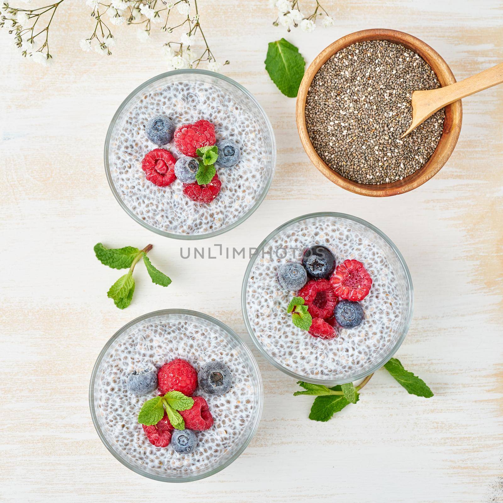 Chia pudding, top view, fresh berries raspberries, blueberries by NataBene