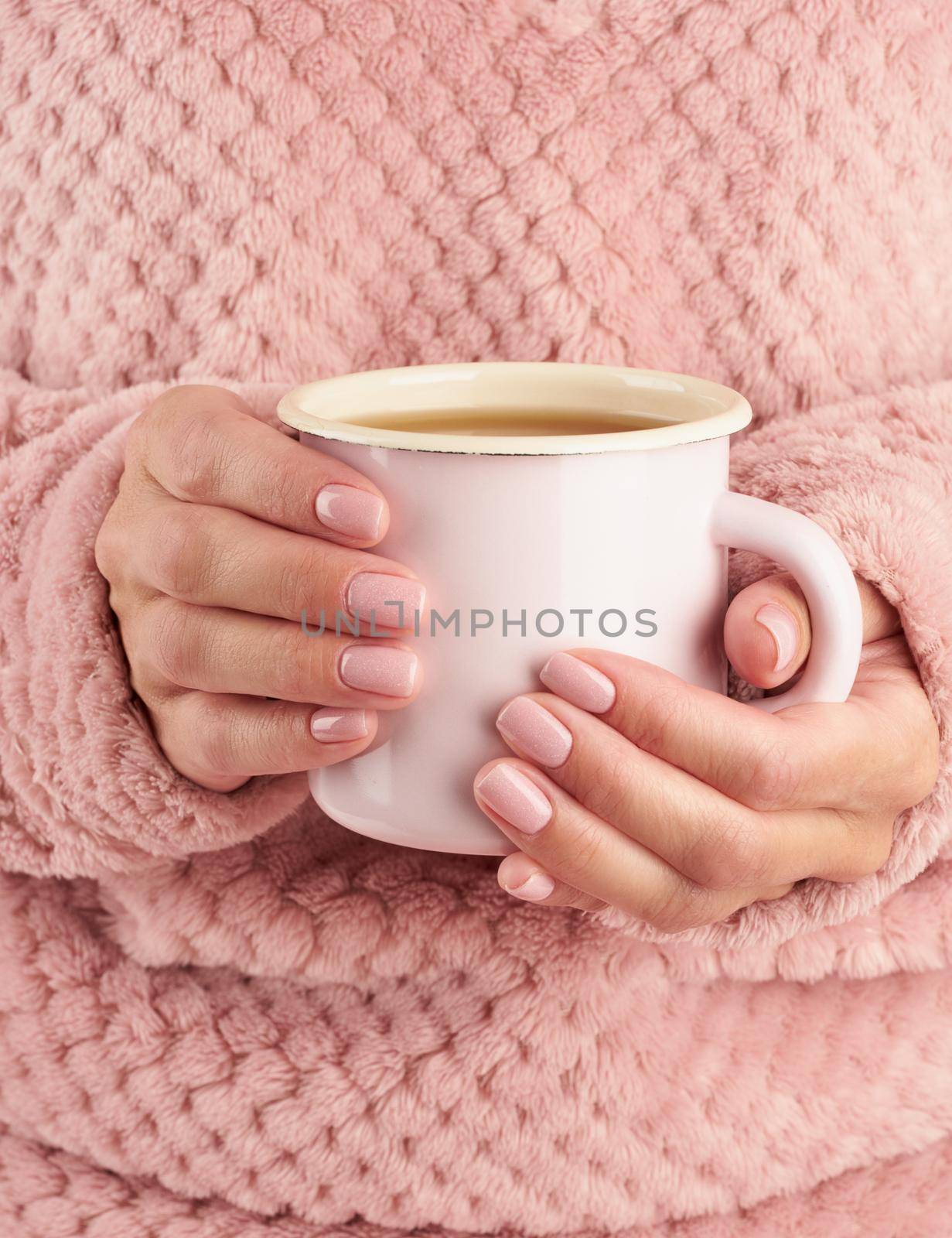 morning hot coffee on cold autumn morning, hands holding a mug with a drink, cozy atmosphere, vertical by NataBene