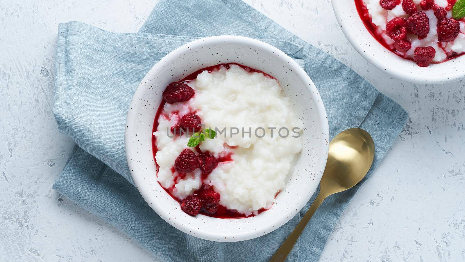 Rice Pudding. Long banner, Vegan Coconut diet breakfast with a coconut milk, raspberry, scandinavian minimalism, top view, copy space