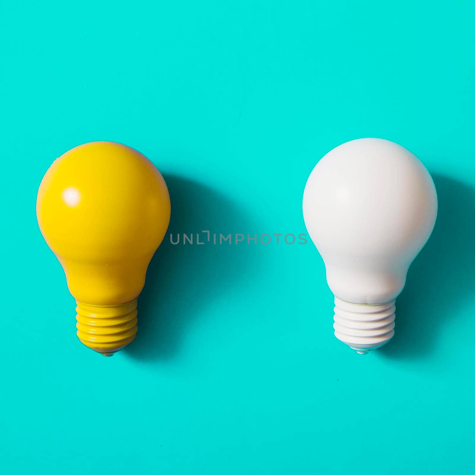 yellow white light bulb turquoise background by Zahard