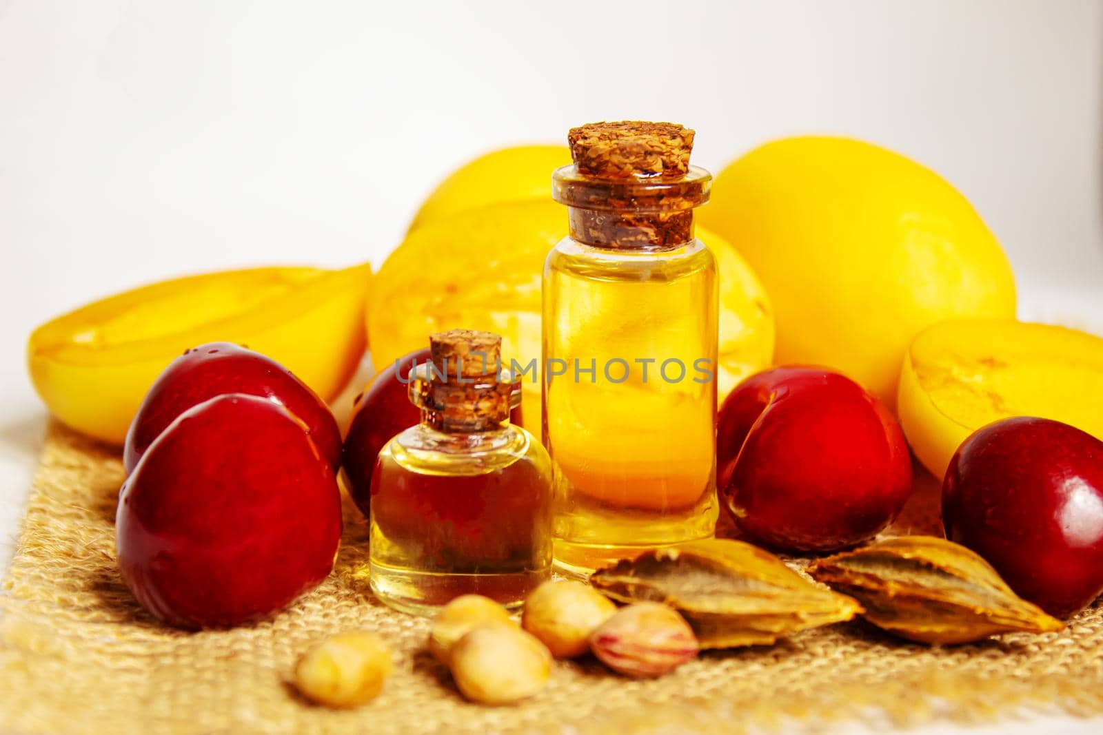 apricot and cherry oil in a small jar. selective focus.nature