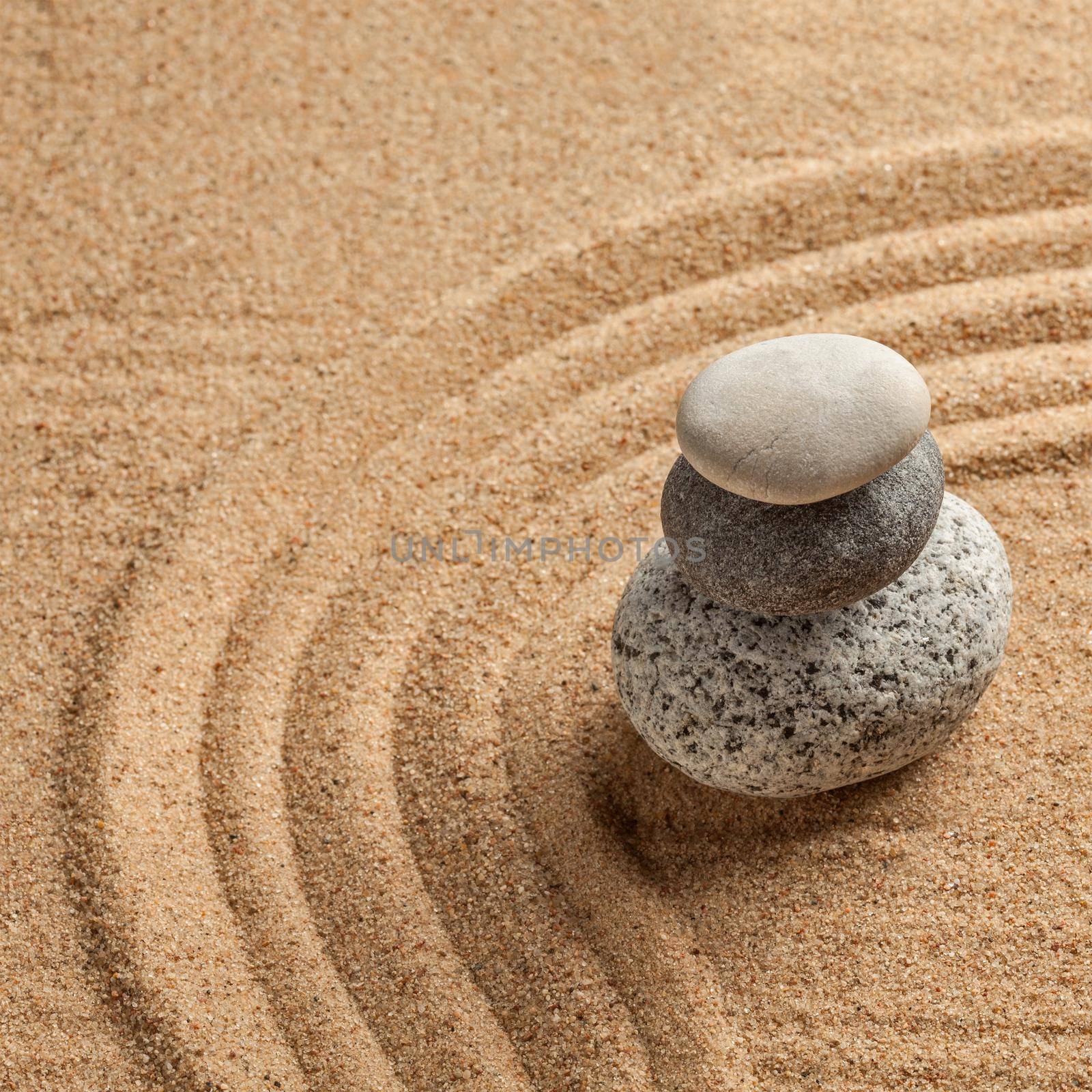 Japanese Zen stone garden - relaxation, meditation, simplicity and balance concept - pebbles and raked sand tranquil calm scene