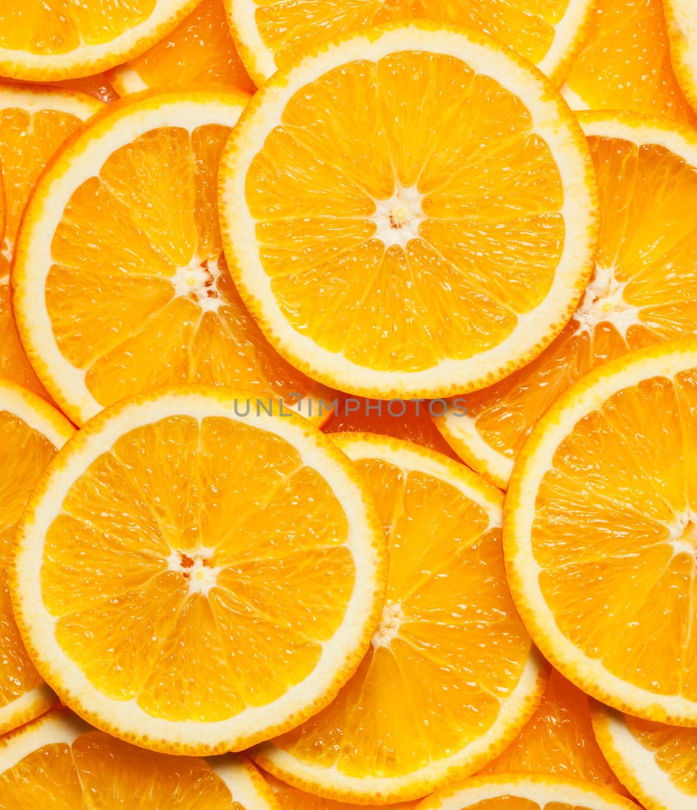 Colorful orange citrus fruit slices background top view