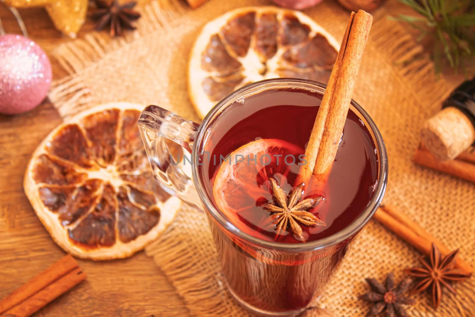 Christmas mulled wine. Merry Christmas. Glass of mulled wine with cinnamon and anise, top view. Selective focus.Holiday