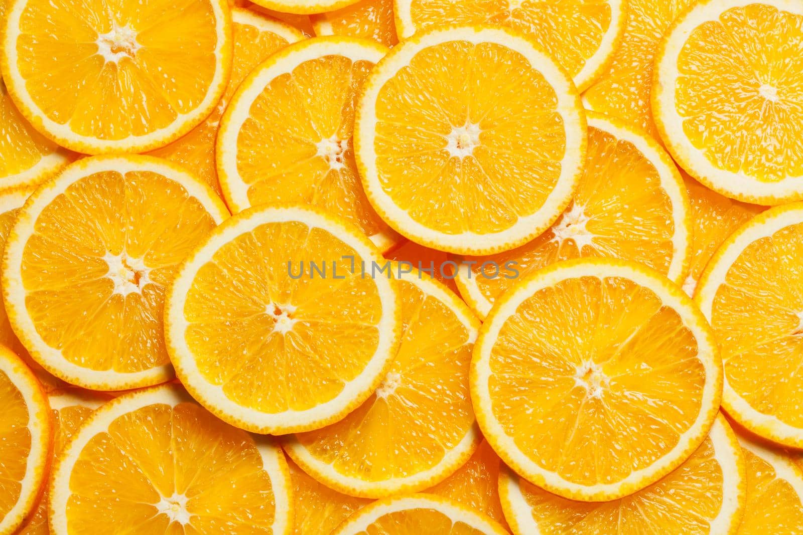 Colorful orange citrus fruit slices background top view