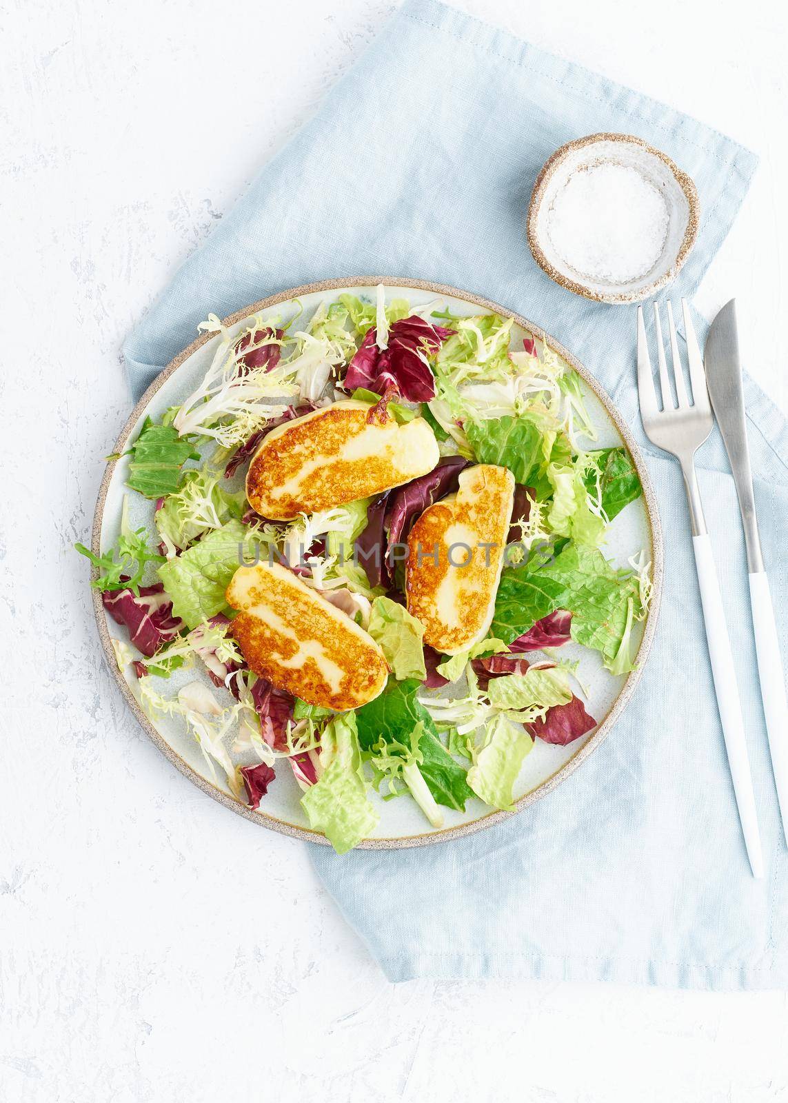 Cyprus fried halloumi with healthy salad. Lchf, pegan, fodmap, paleo, scd, keto, ketogenic diet. Balanced food, clean eating recipe. Vertical