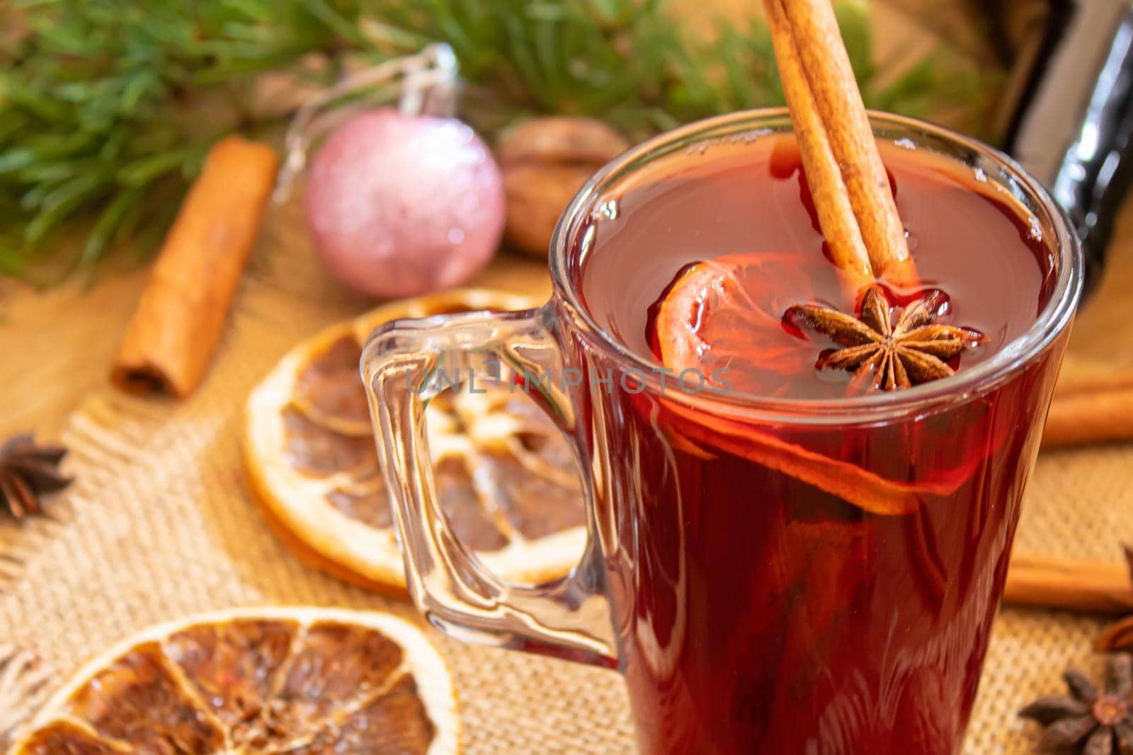 Christmas mulled wine. Merry Christmas. Glass of mulled wine with cinnamon and anise, top view. Selective focus.Holiday