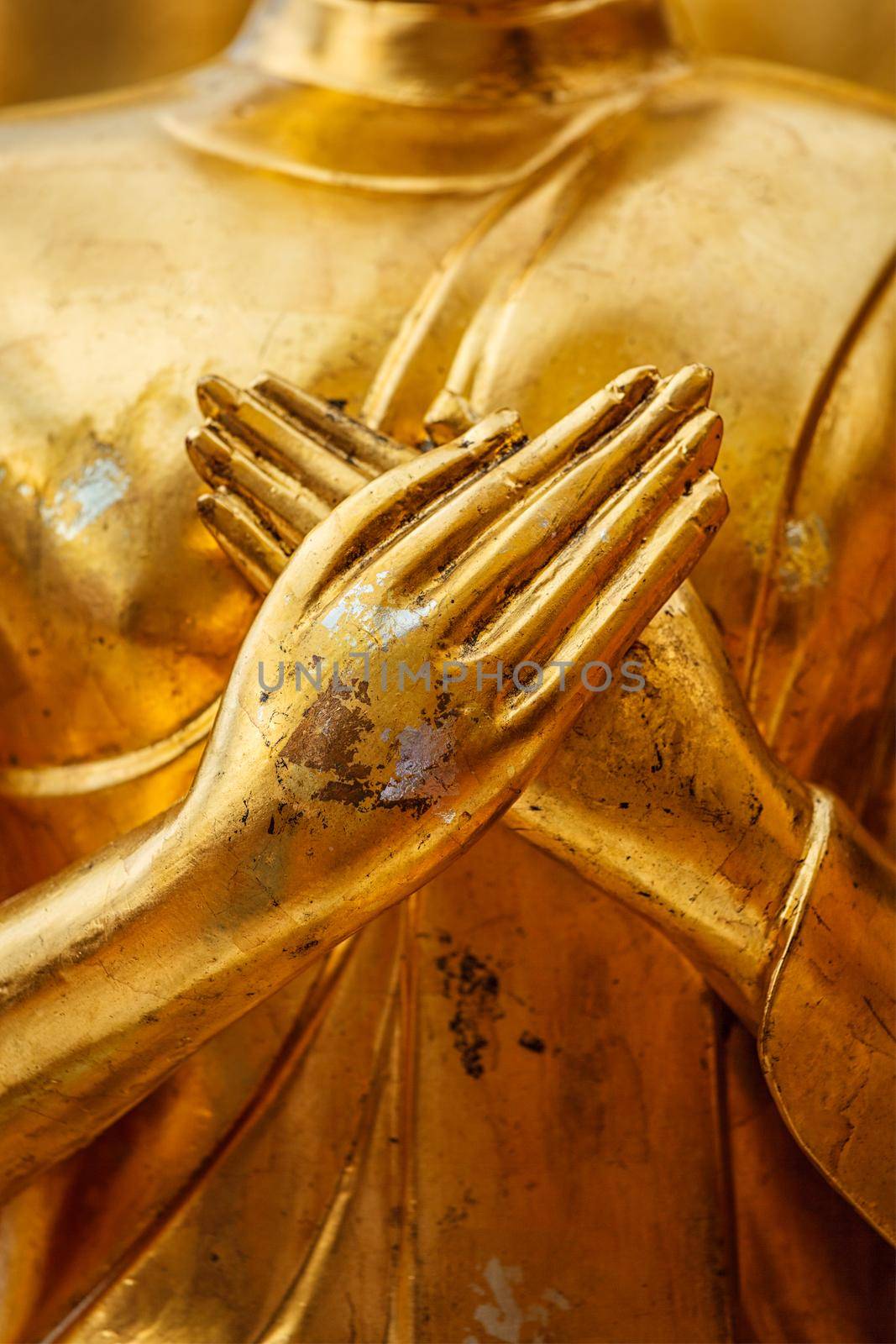 Buddha statue hands close up by dimol