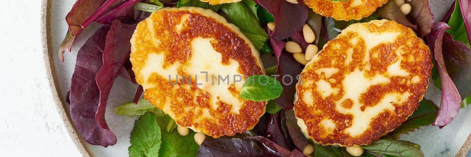 Cyprus fried halloumi with salad mix, beet tops. Lchf, pegan, fodmap, paleo, scd, keto by NataBene