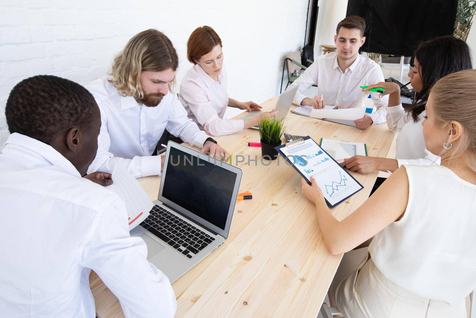 Diversity Teamwork Brainstorming Meeting Concept.Business Team Coworker Global Sharing Economy Laptop Graph. People Working Planning Start Up.Group Young Man Women Looking Report Office