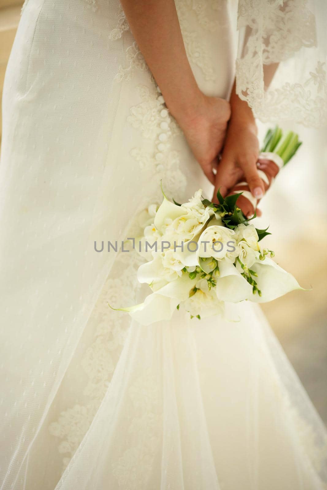 bouquet in the hands of the bride