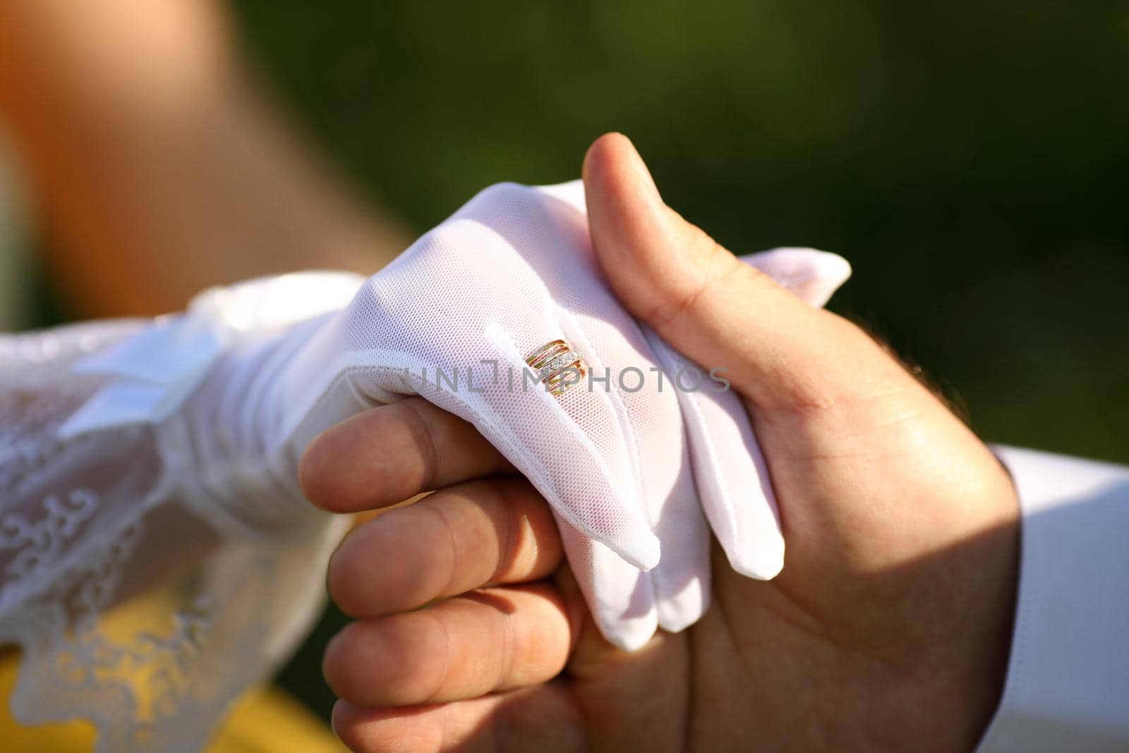 Loving couple holding hands with rings