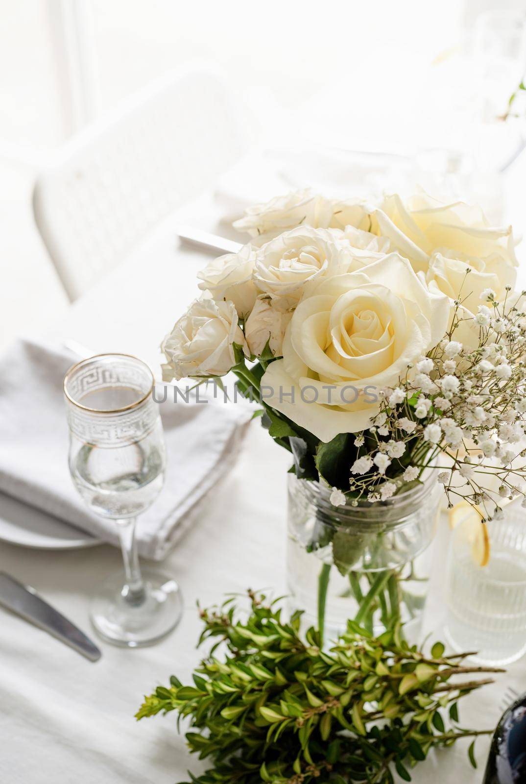 The wedding decor. Wedding teble decoration with white roses, closeup by Desperada