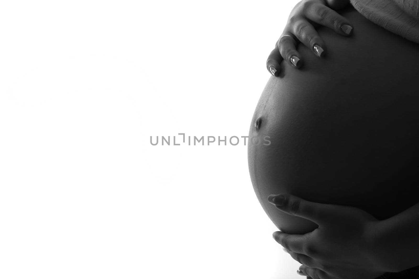 pregnant woman holding her belly