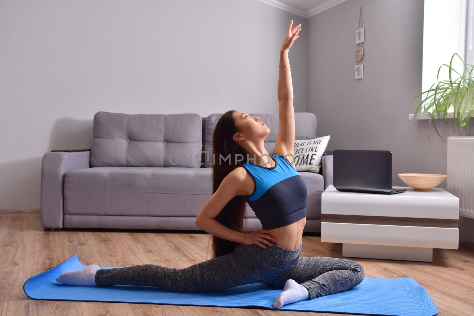 Young asian woman making online training yoga by Bonda