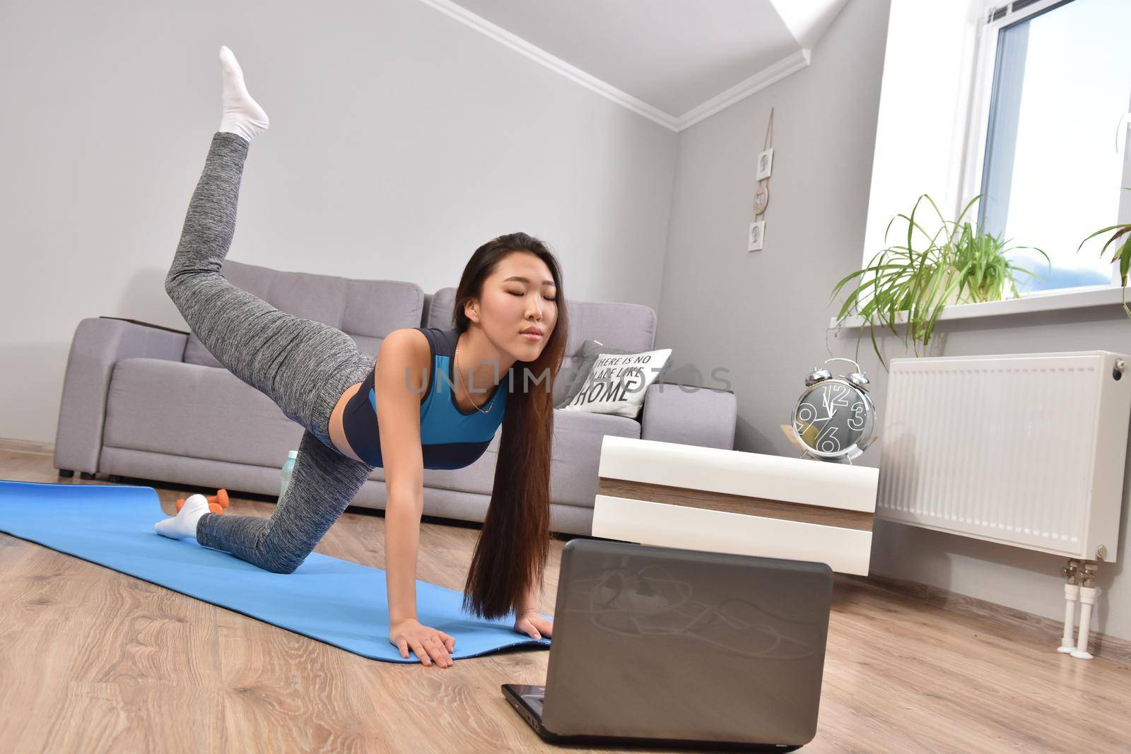 Young asian woman making online training yoga by Bonda