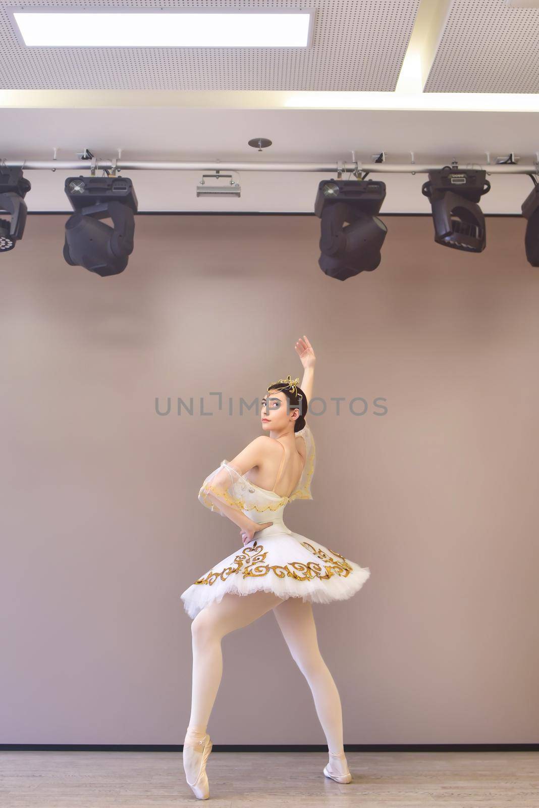 Young beautiful ballet dancer practice to make pirouette by Nickstock
