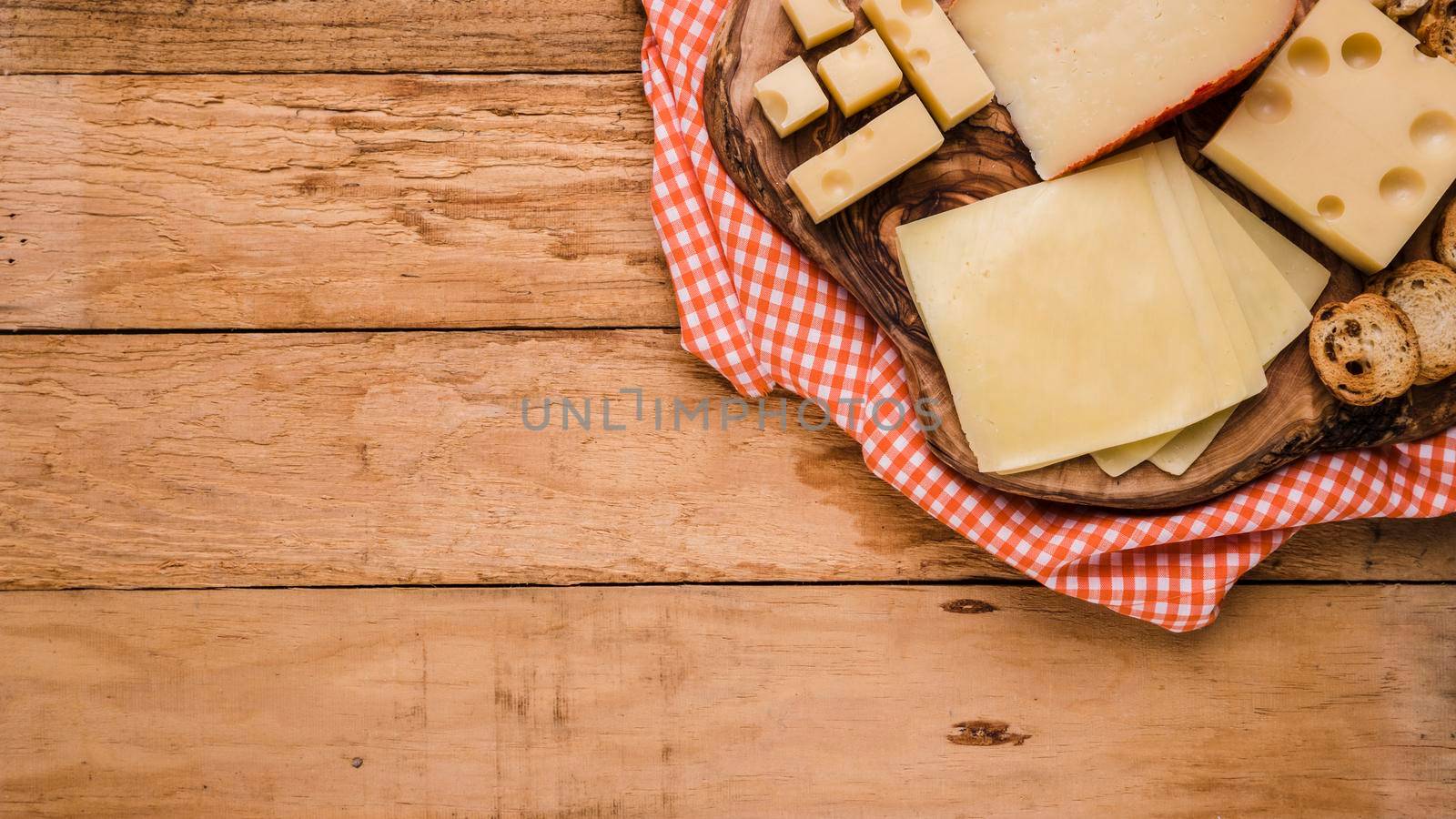 different types cheeses wooden coaster with table cloth bench by Zahard