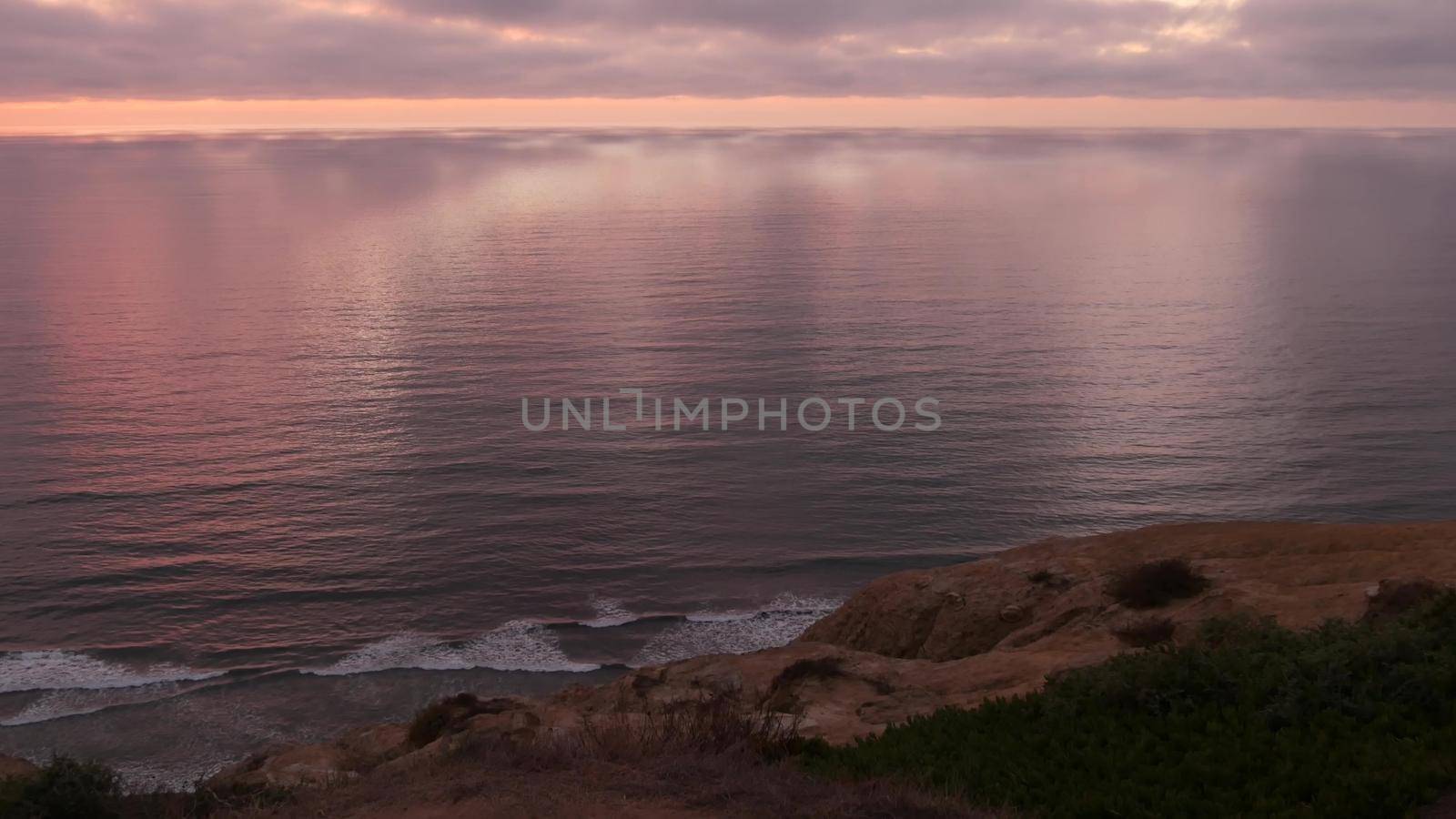 Dramatic sunset, sky and clouds. Torrey Pines, California coast, ocean sea water by DogoraSun