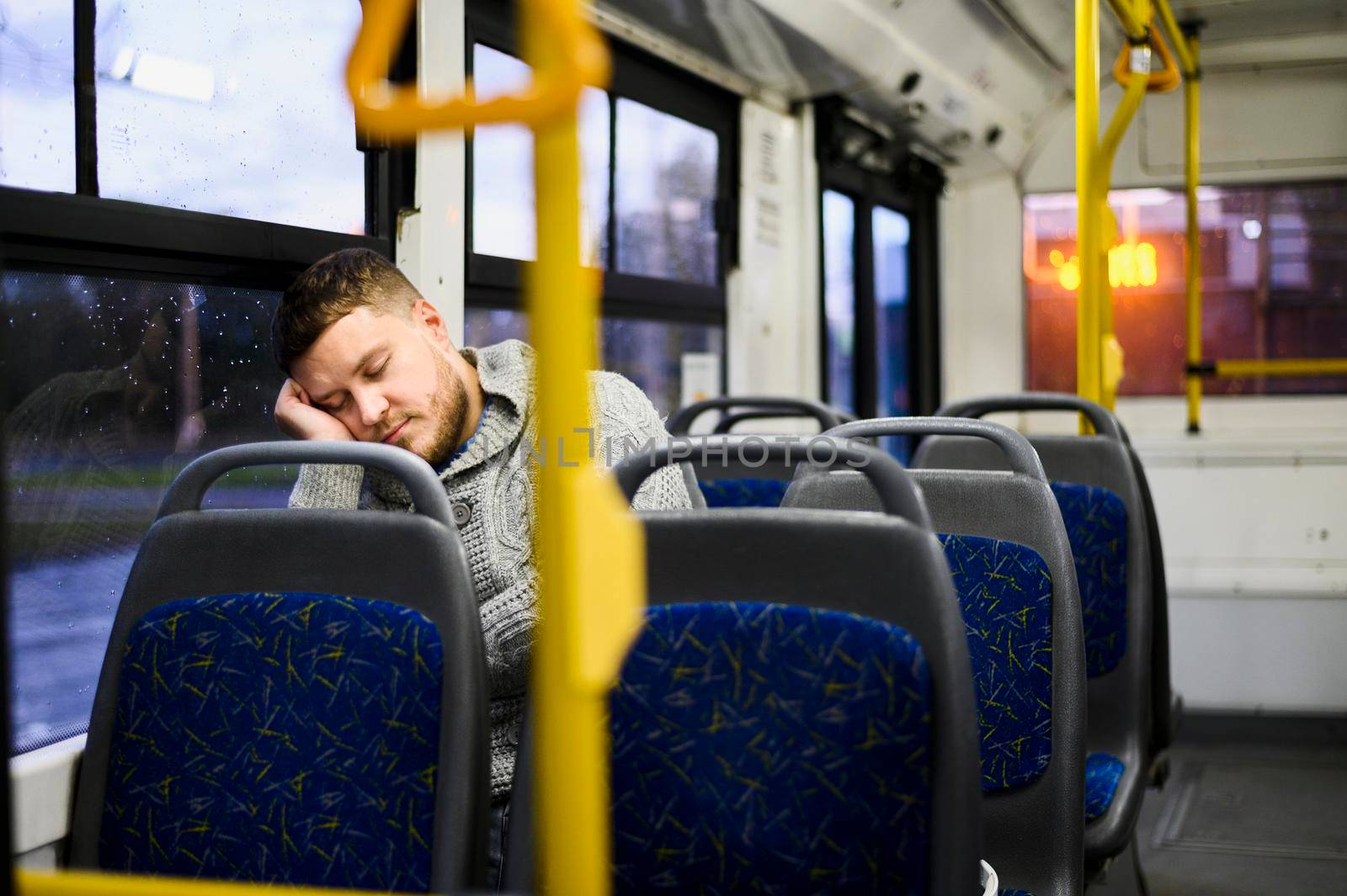 young man sleeping bus seat by Zahard