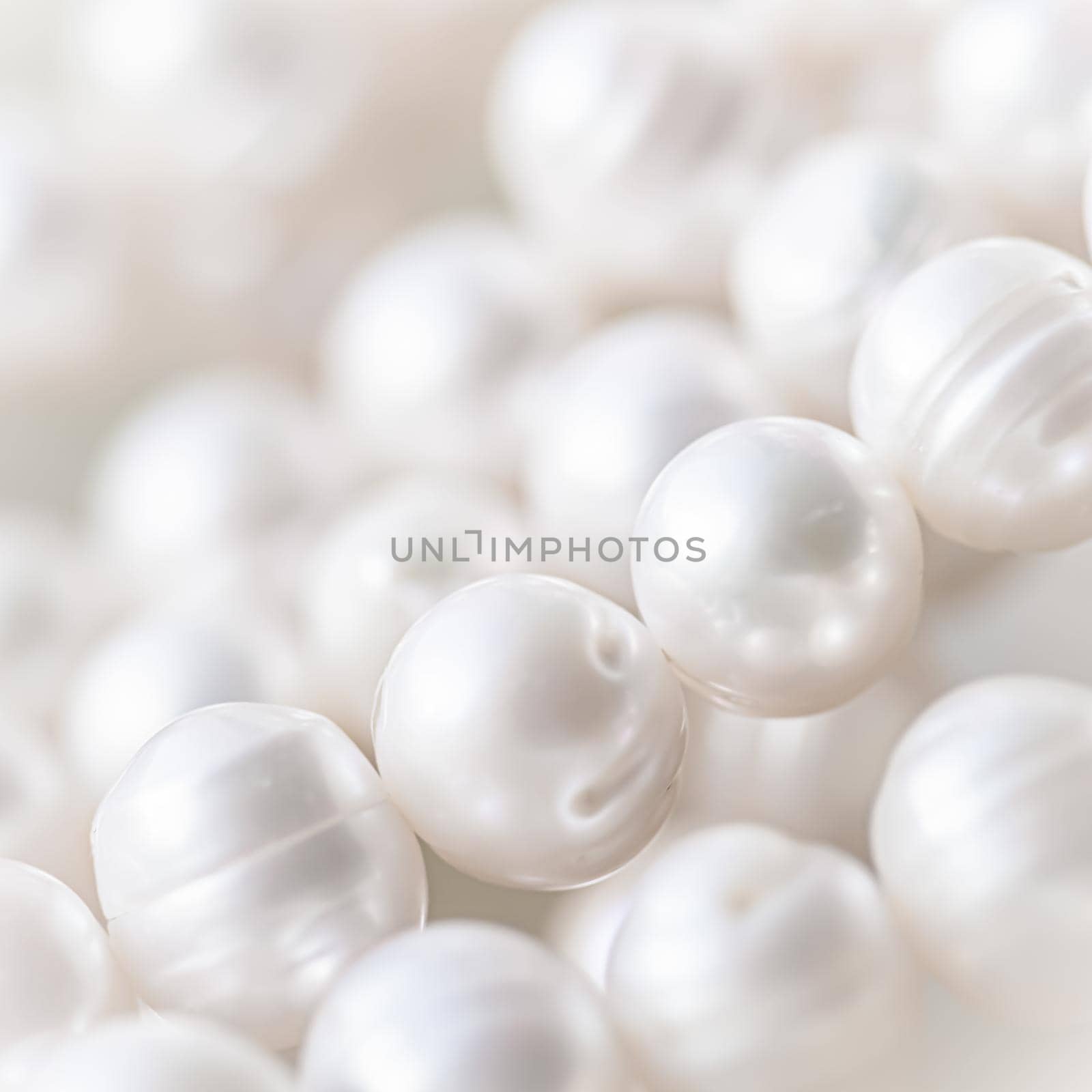 Nature white string of pearls in soft focus, with highlights by Olayola