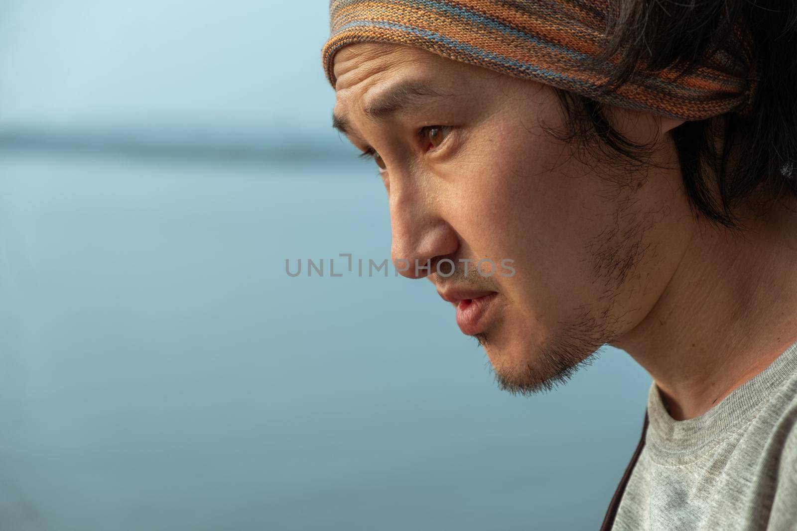 Side View Of Young Man Against Sea